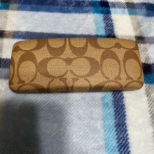 This is a never before used Coach glasses holder.